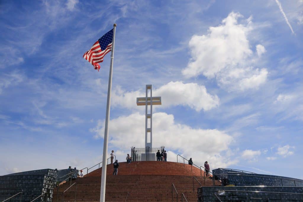 The cross and American flag at the top of Mount Soledad.