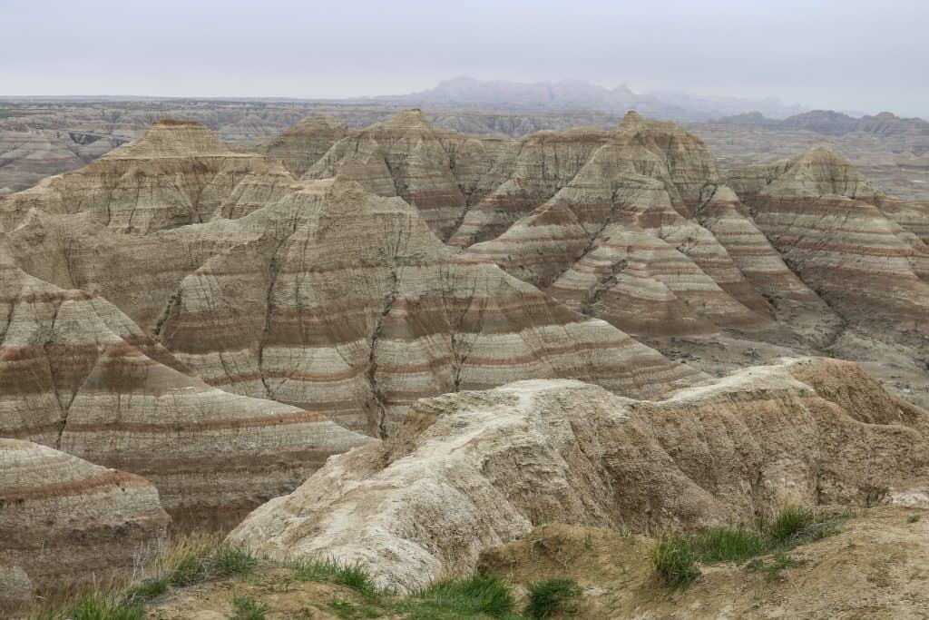 Striated rock formations in the Badlands National Park.