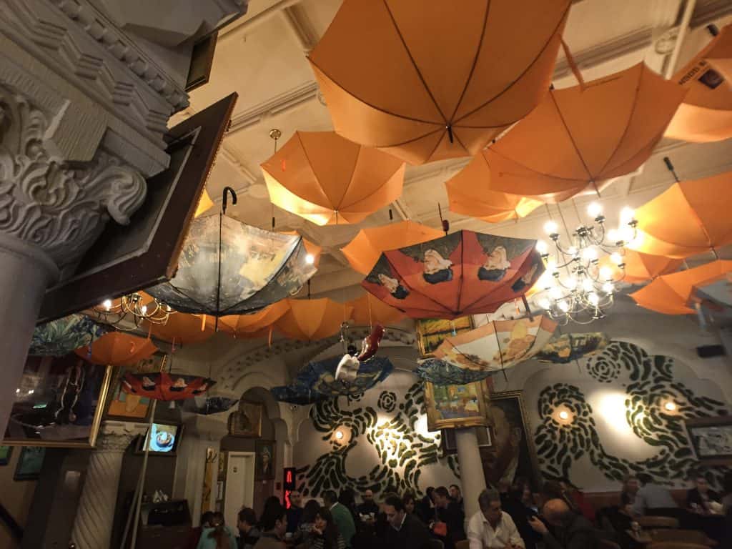 The whimsical hanging umbrellas inside the Grand Café Van Gogh.