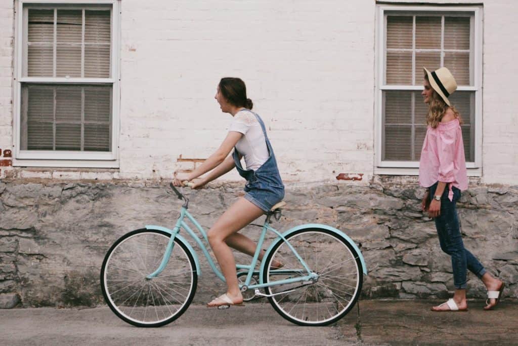 girl riding a bike is a great way to get in a workout on vacation