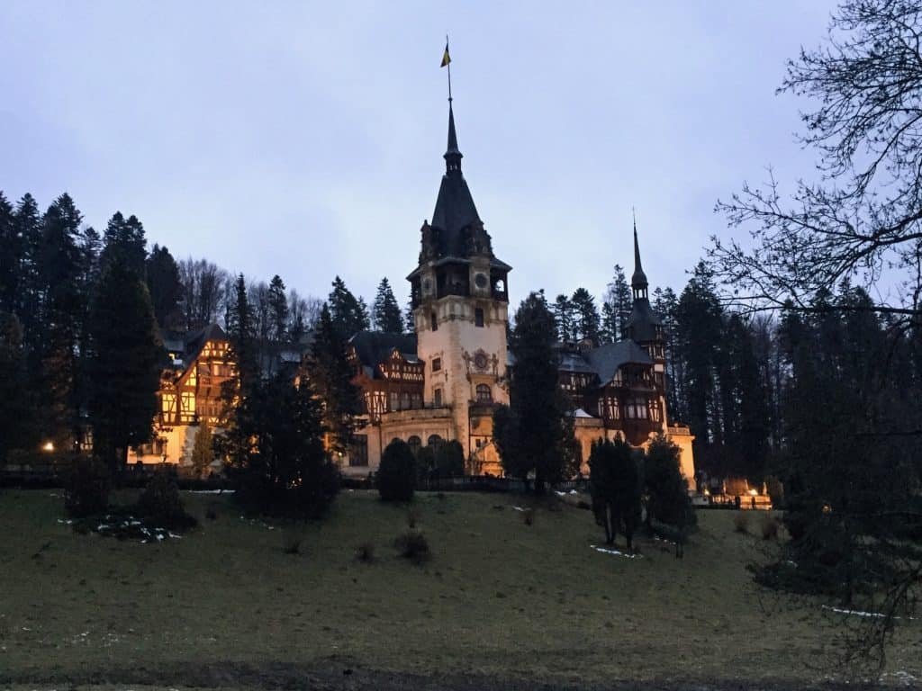 The evening lights give Peles Castle a warm glow...