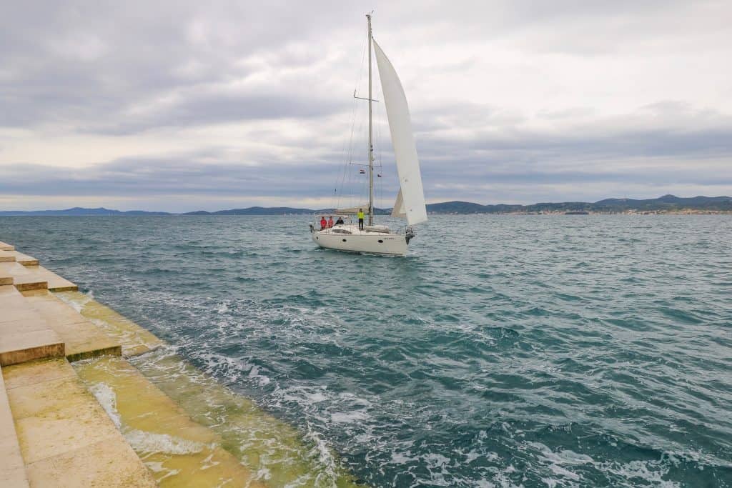 Sail boat passing by the Sea Organ steps