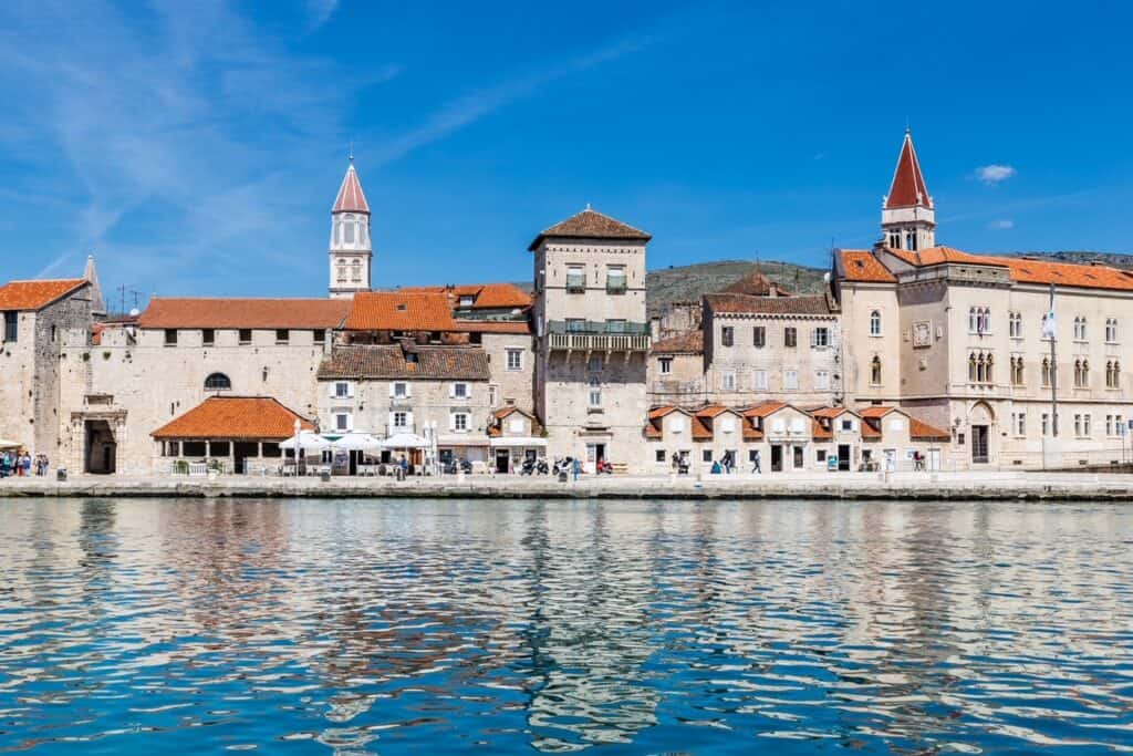 Seafront Promenade, Old Buildings And Church Tower of Monastery of St. Nicholas in Trogir, Croatia