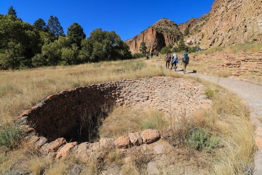 The large hole lined with rocks is a kiva that was the center of religious activities, education and decision-making at Bandelier National Monument in New Mexico.