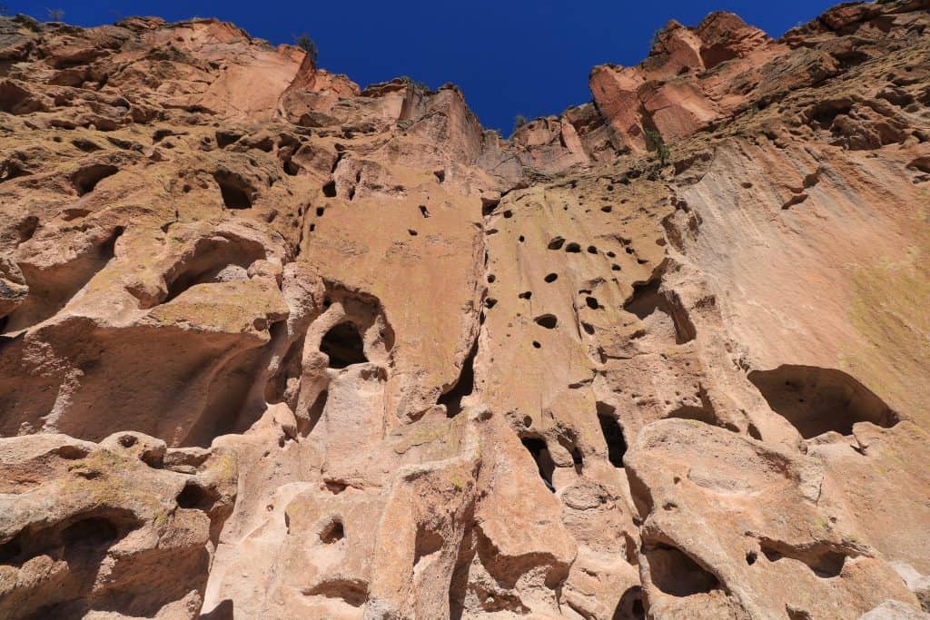 The rock formations are made of compacted volcanic ash throughout Bandelier National Monument.