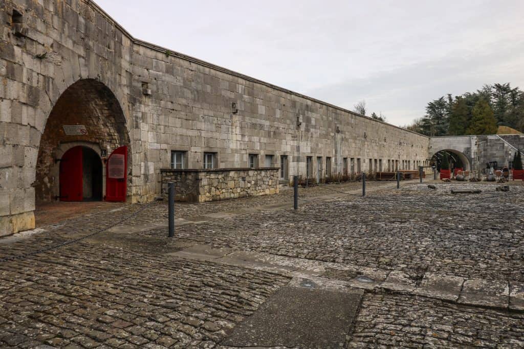 The large open stone courtyard of Citadel de Dinant in Dinant, Belgium.