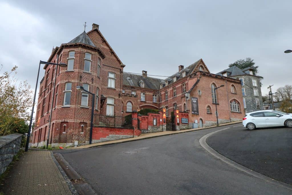 The red brick made La Merveilleuse Hotel, previously the Bethleem Convent above the river in Dinant, Belgium.