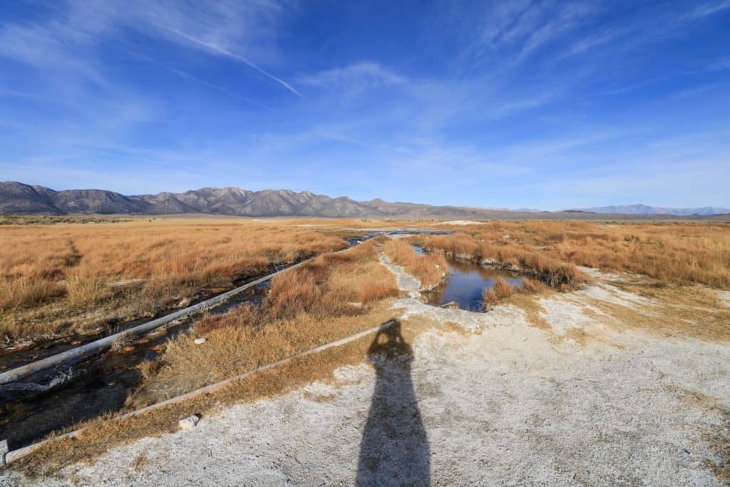 The creeks hot water supplies the various small pools with hot spring water that is very relaxing to soak in and views of the mountains in the distance.