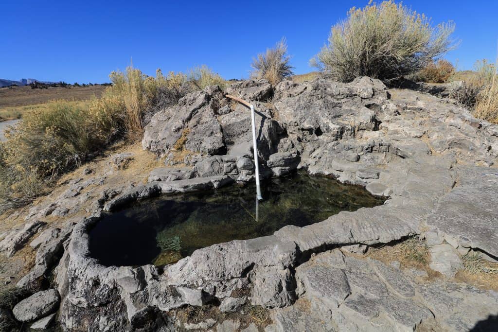 You can see the pipe that pumps water into the small Rock Tub in Mammoth Lakes, CA.