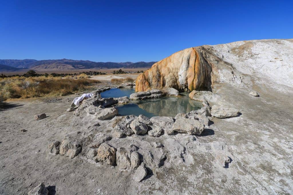 The Travertine Hot Springs is the most unique looking with a series of separate pools all next to each other and the salty rock backdrop.