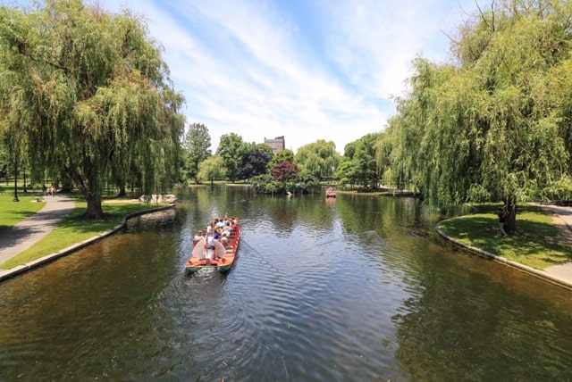 A Swan boat ride tour on the lagoon in the Public Garden in downtown Boston, MA.