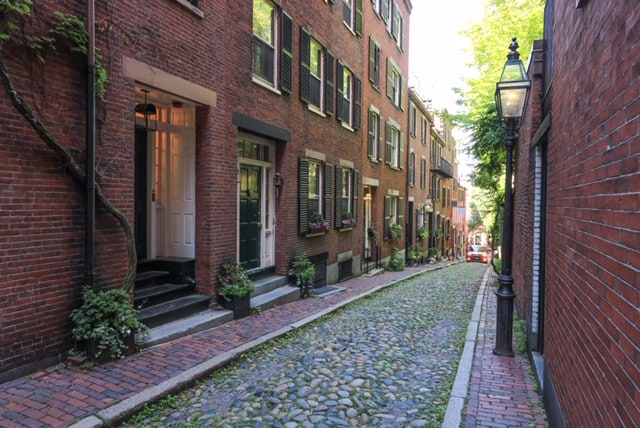 Acorn Street is one of the most photogenic streets in America with its pedestrian only cobblestone street, brick homes and old street lanterns in Boston.