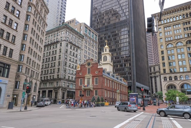 The Old State House nestled among the modern buildings of Boston along the Boston Freedom Trail.