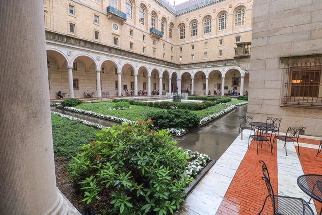 The beautifully manicured inner courtyard of the Public Library in Boston with one of the best things to do on a weekend in Boston.