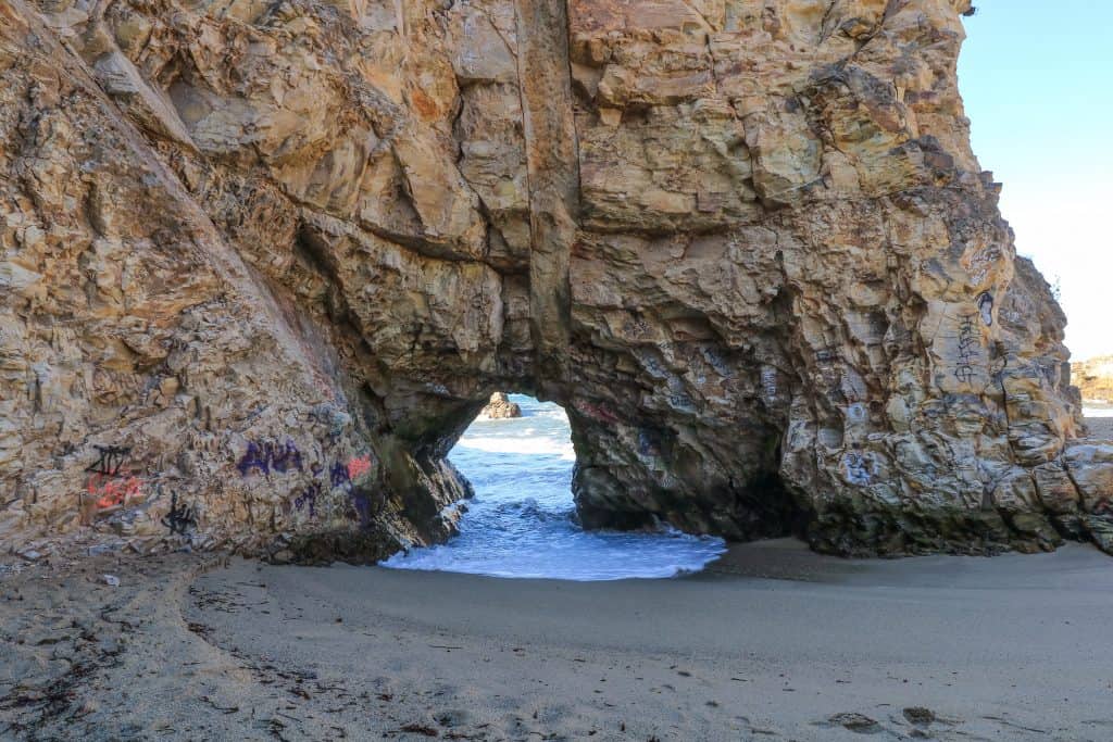 Small beach cave to the ocean on the other side
