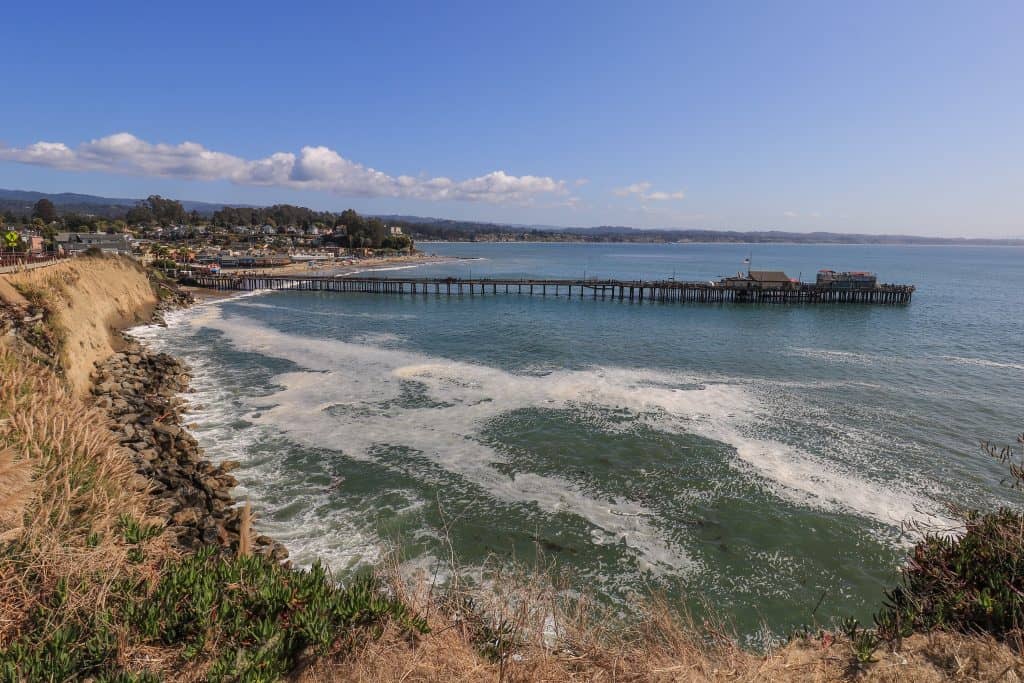 View of Capitola Beach and pier on a sunny day in California