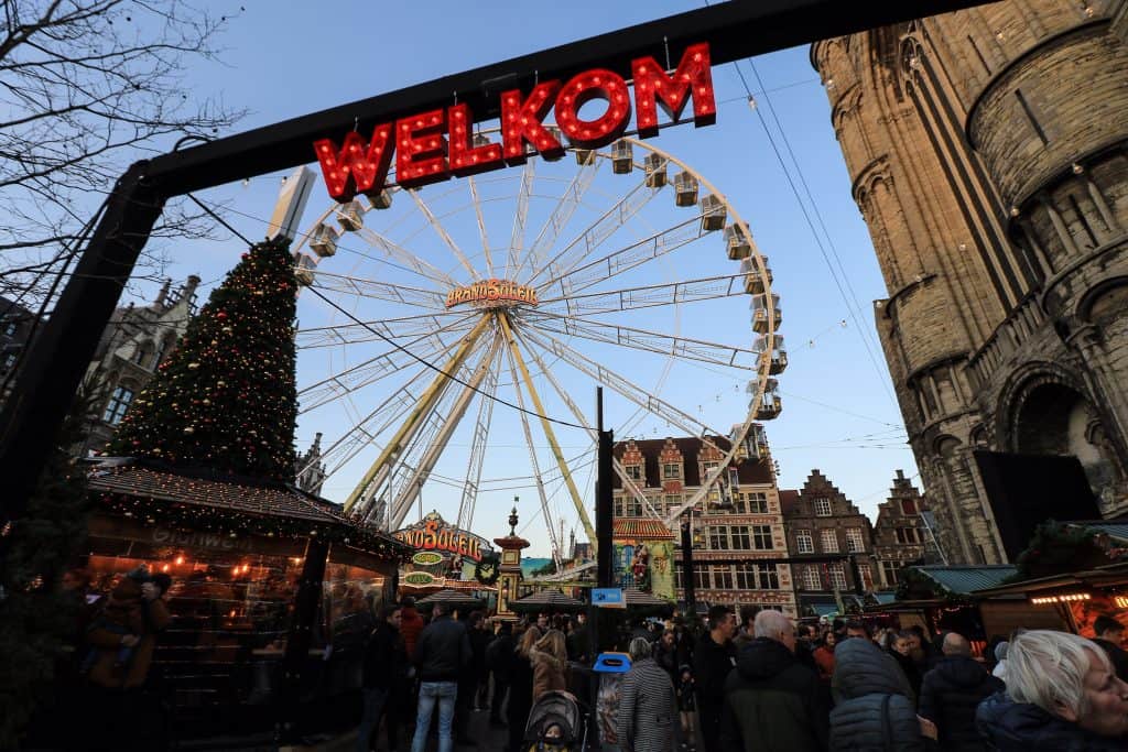Food stalls surround the Ferris wheel at the Ghent Christmas market