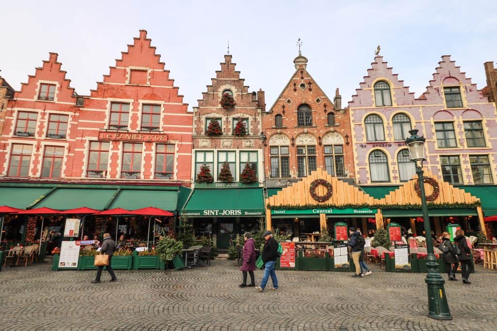 The buildings surrounding the Grote Markt are colorful and enchanting