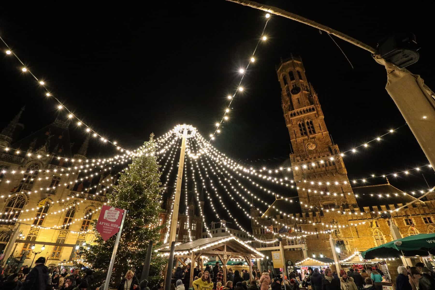 Sparkling lights and a Christmas tree in the main square of Bruges, Belgium