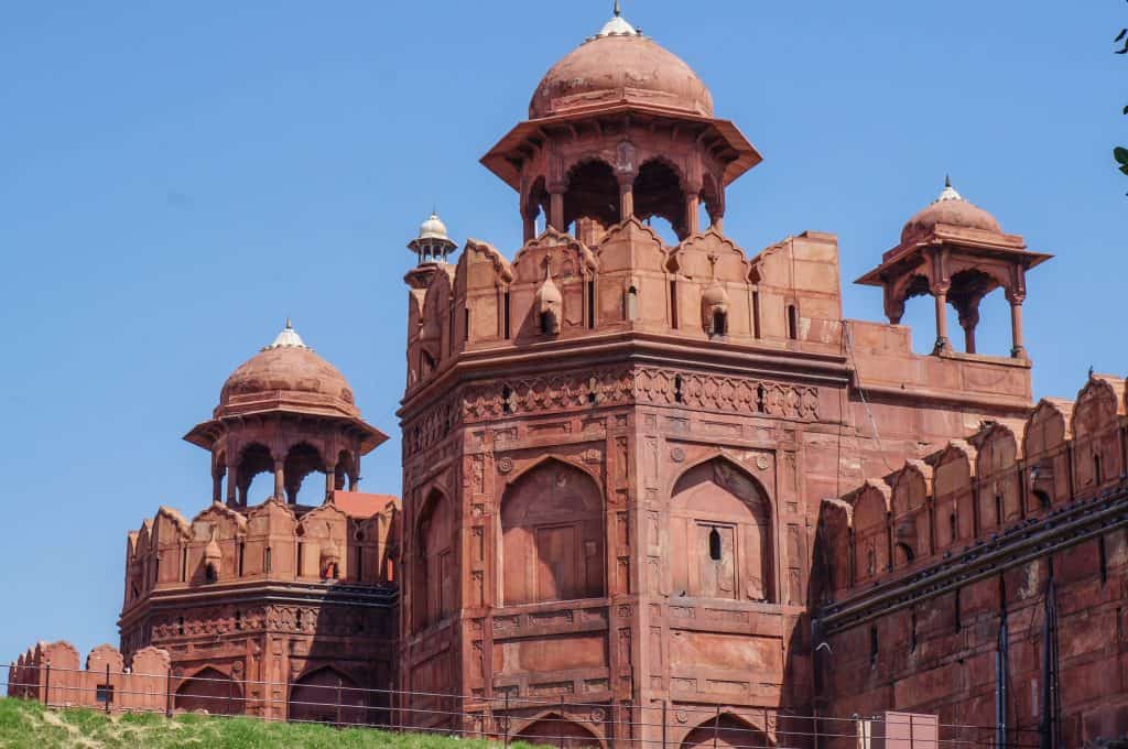 The impressive outer wall of the Red Fort in Delhi made of red sandstone and beautifully carved craftsmanship