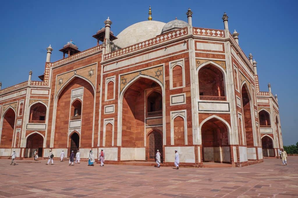 A side and close-up view of the enormous size of Humayun's Tomb in Delhi