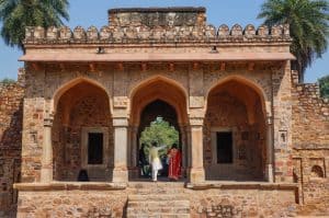 A newly wed Indian couple taking photos at Humayun's Tomb