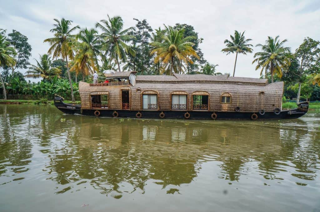 An Alleppey houseboat cruising along the backwaters of Kerala.