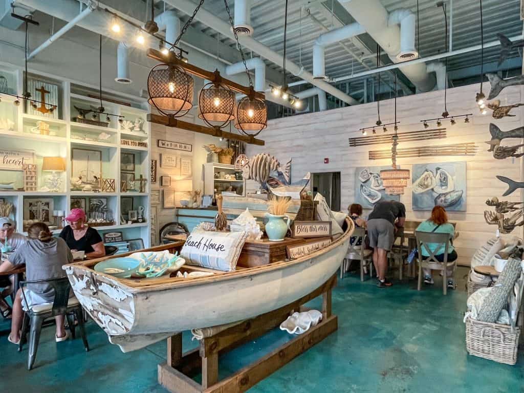 A white and turquoise beach themed interior of The Southern Grind coffee house.