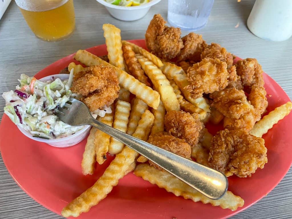 The famous and delicious fried shrimp from Doc's Seafood along with fries and plenty of tartar sauce.