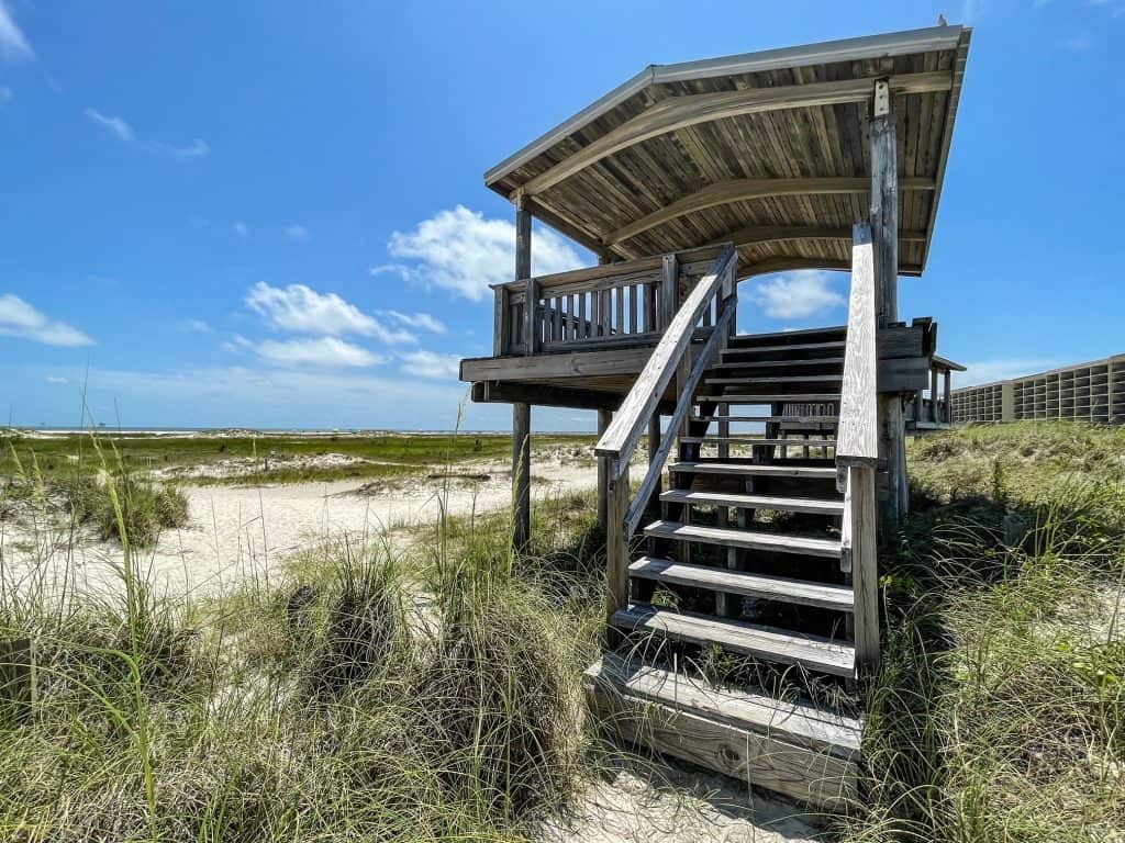 An elevated hut on the beach where you can look out and view Dauphin Island Public Beach,