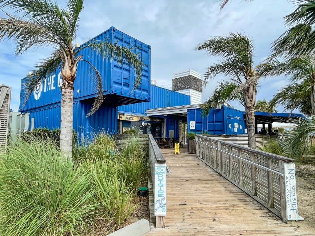 The vibrant royal blue shipping containers that make up The Gulf beach bar in Orange Beach.