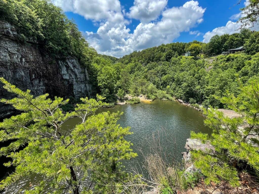 View looking out at the large pool formation and forest around the top of DeSoto Falls in Northern Alabama.
