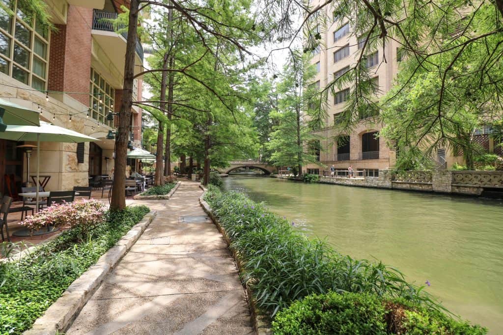 Walking on a beautiful path along the San Antonio River Walk and under Cypress trees is one of the most relaxing things to do in San Antonio.