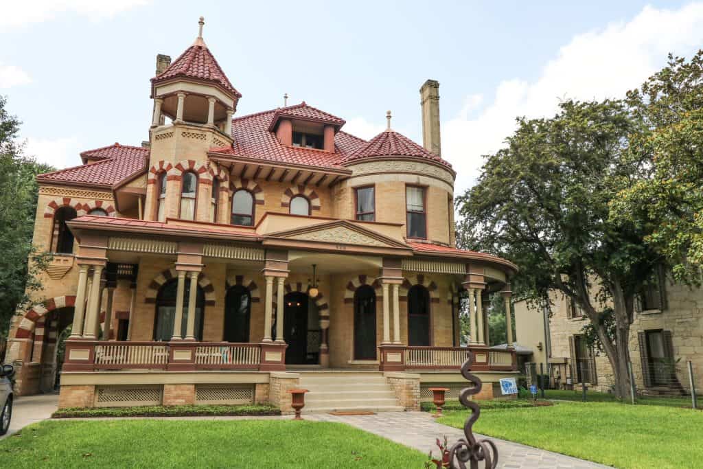 One of historic houses in King William District with detailed brown and tan colors.