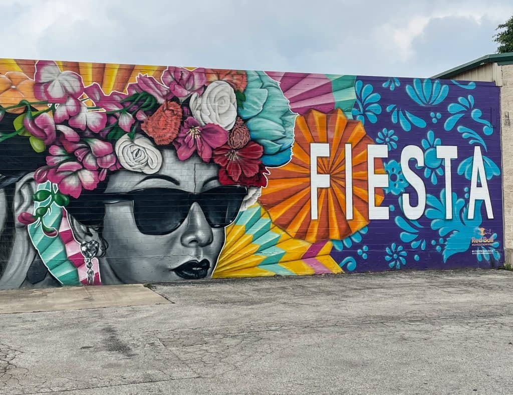 Part of the "Let's Fiesta" art mural with just the words "Fiesta" and the woman's face next to it.