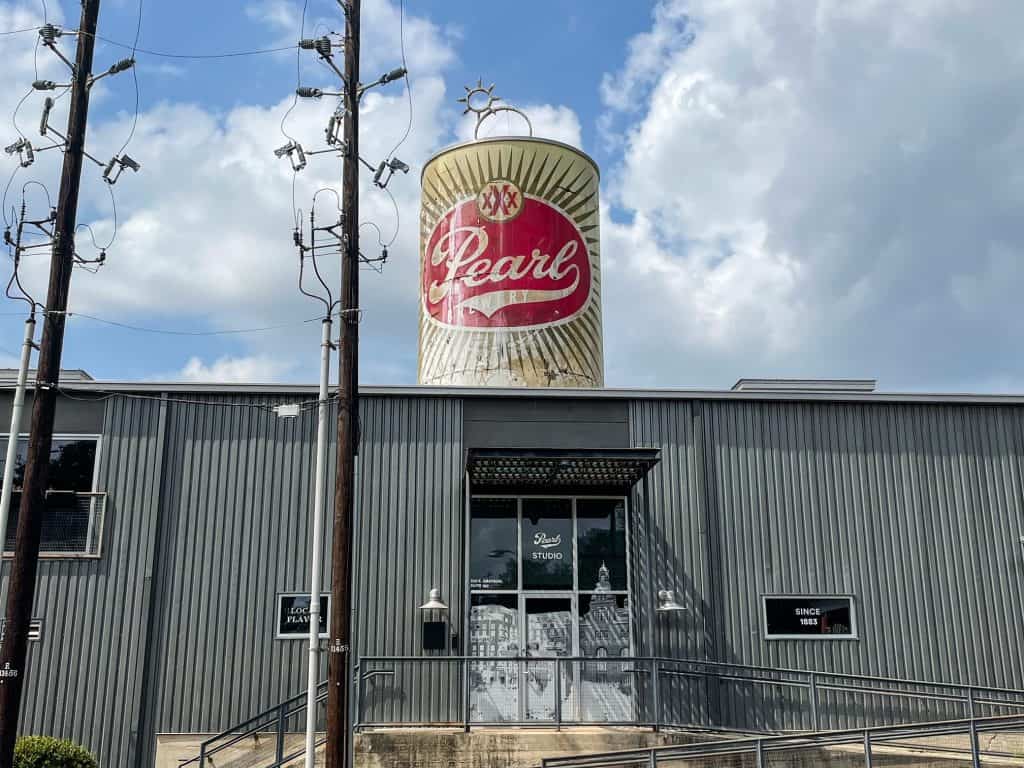 A structure that looks like a huge can of Pearl beer on the roof of a building in the Pearl.