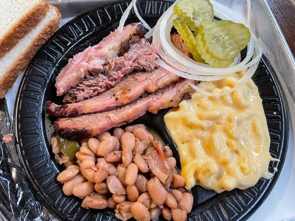 A BBQ plate of brisket, mac & cheese, pickles, borracho beans and bread at Augie's BBQ in San Antonio.