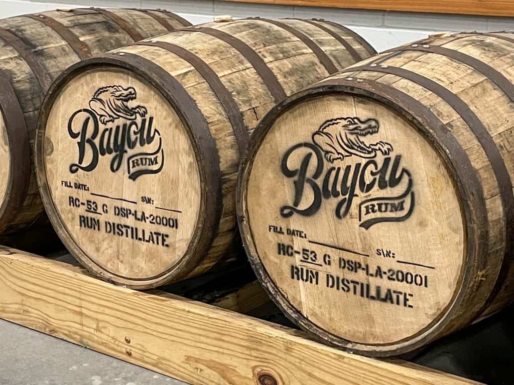 Huge wooden casks of rum with the logo Bayou Rum on the top.