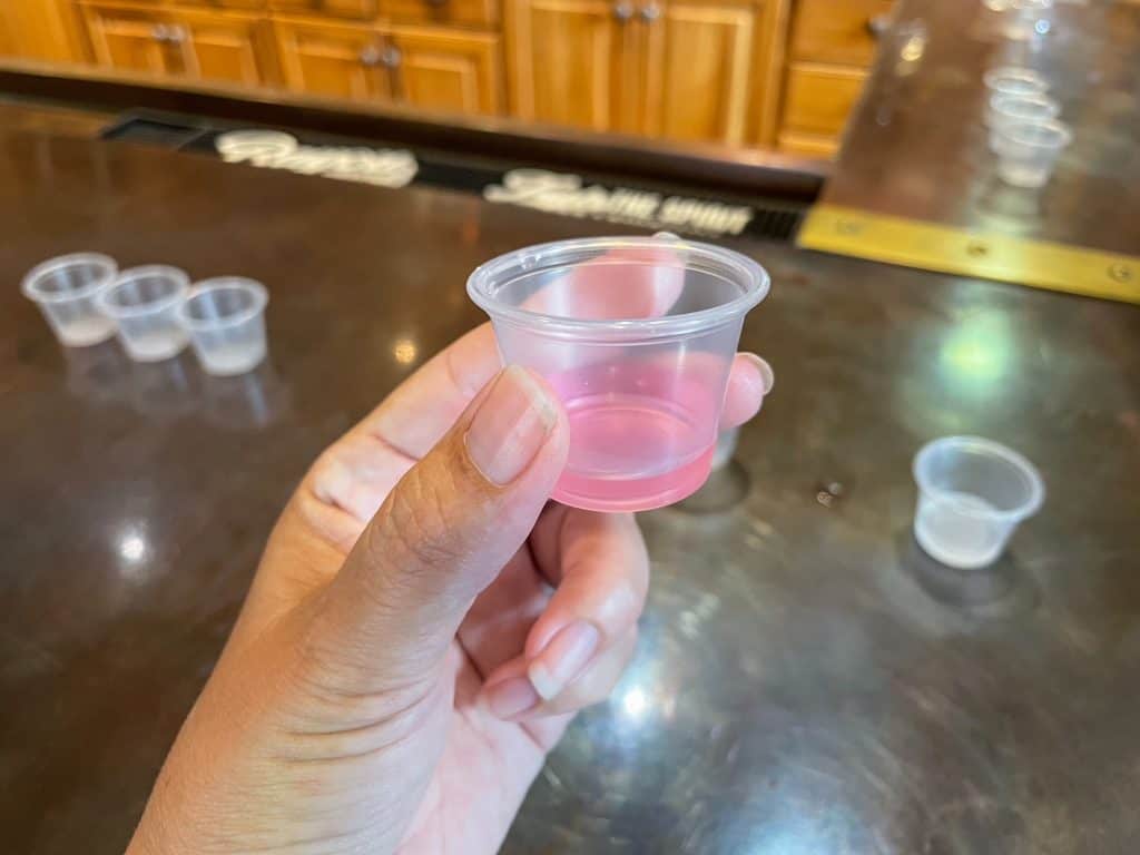 Tasting a rum that has a pink color to it.