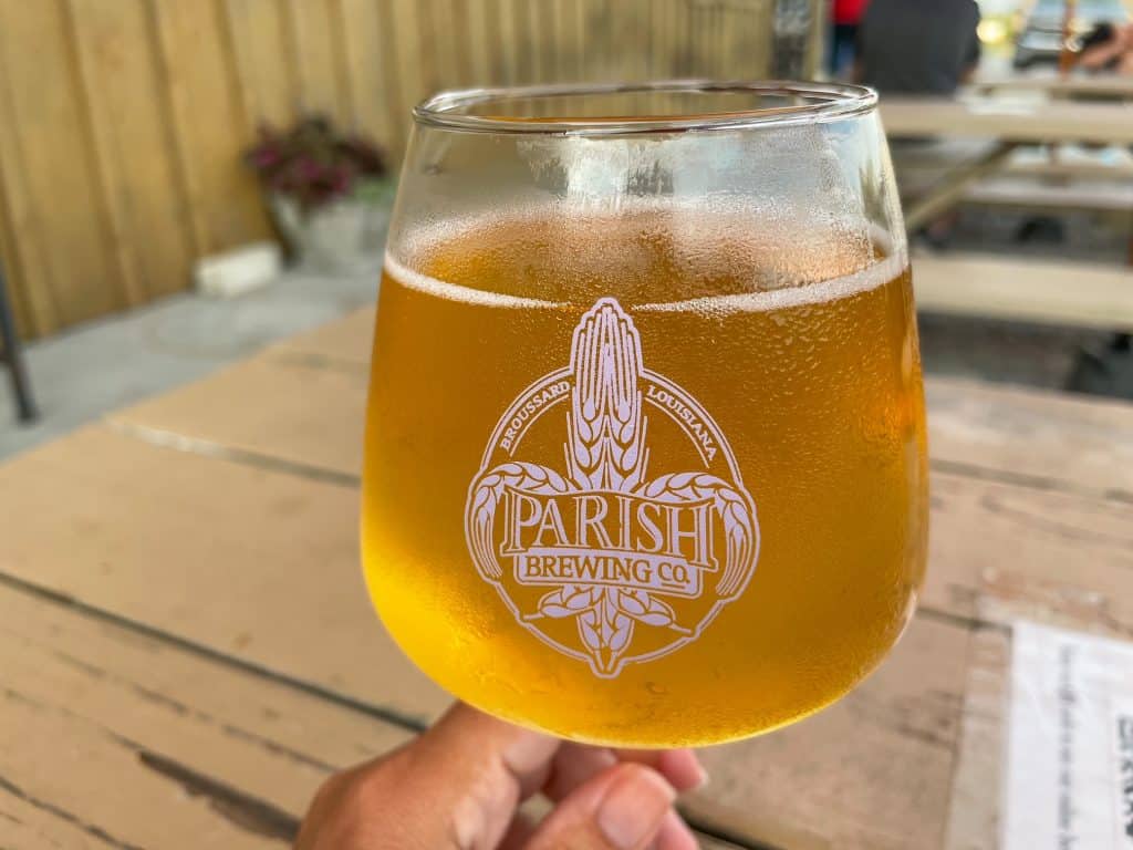 Sipping an ice cold Parish Pilsner at a table outside of the Parish Brewing Company.