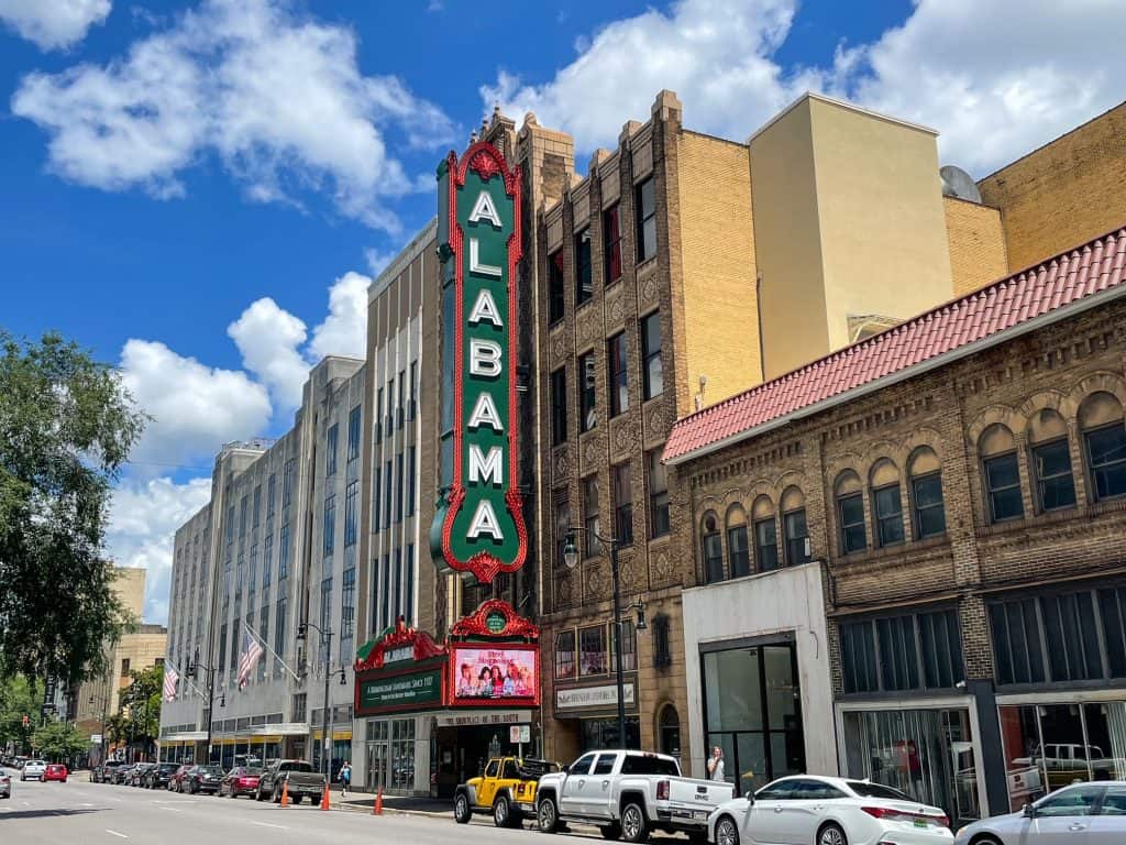 The front of the Alabama Theatre with the huge vertical sign that spells ALABAMA.