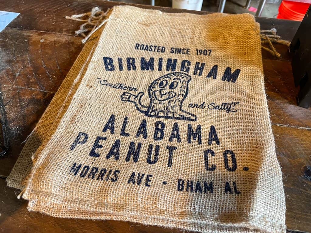 A small burlap bag with the Alabama Peanut Co logo on it.
