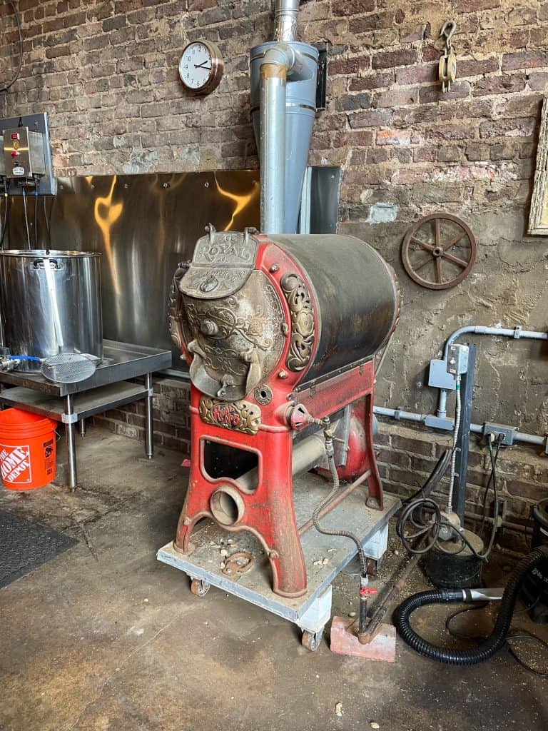 An antique peanut roaster that is still used today.
