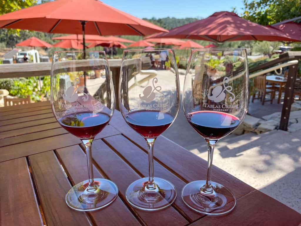 Tasting of three different red wines at an outdoor table at Tablas Creek.