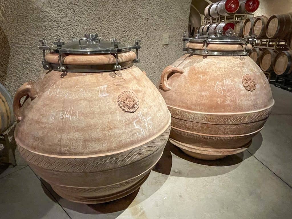 Large clay tanks holding wine.
