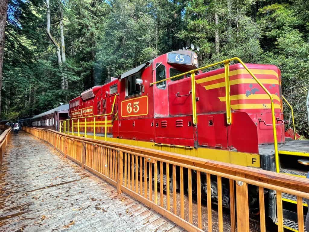 A close-up view of the front of the Skunk Train in red and yellow colors.