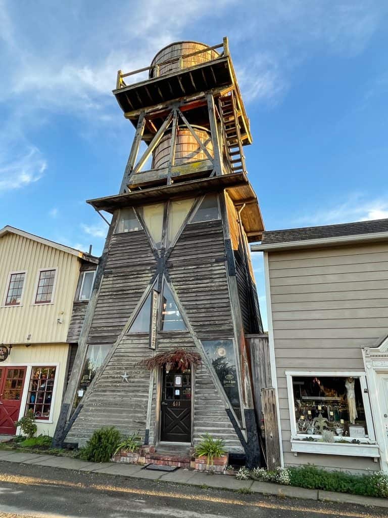 A wooden old water tower that is now used as a business in Mendocino.