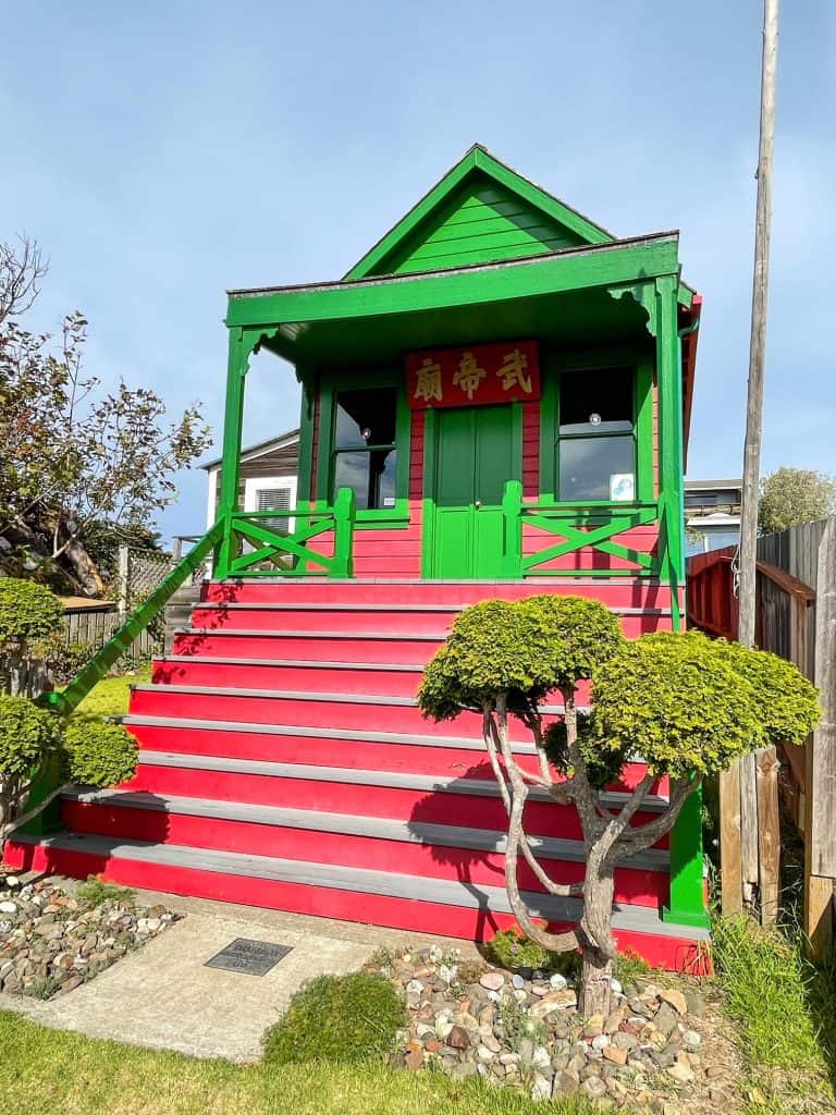 The small vibrant green and red Temple of Kwan Tai in downtown Mendocino.