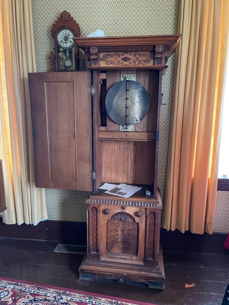 A beautiful antique standing clock in the Kelley House.