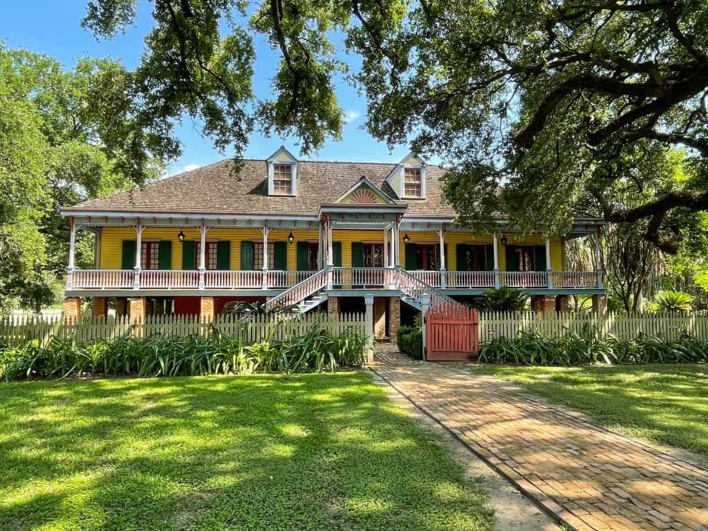 A beautiful yellow large house where the owners of a plantation lived outside of New Orleans.